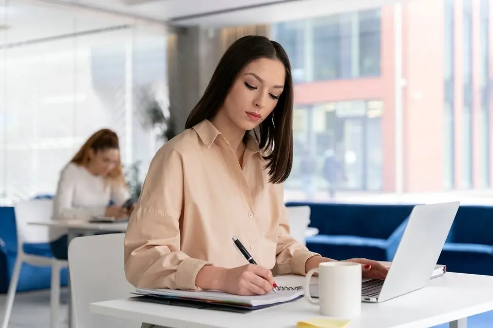 a women writing on note